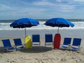 Beach chairs and umbrellas for rent at Just For the Beach Rentals